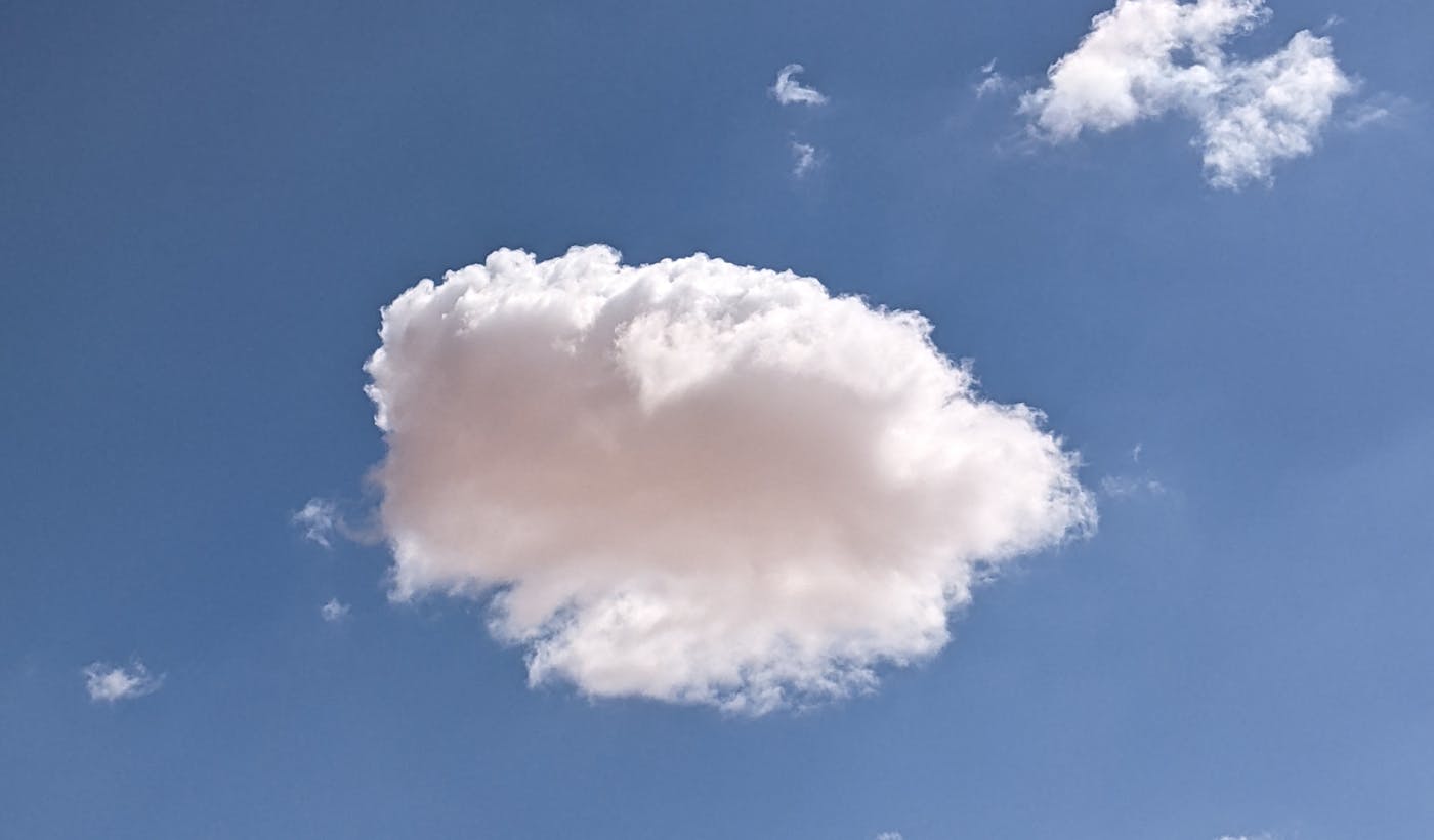 White clouds against a clear blue sky