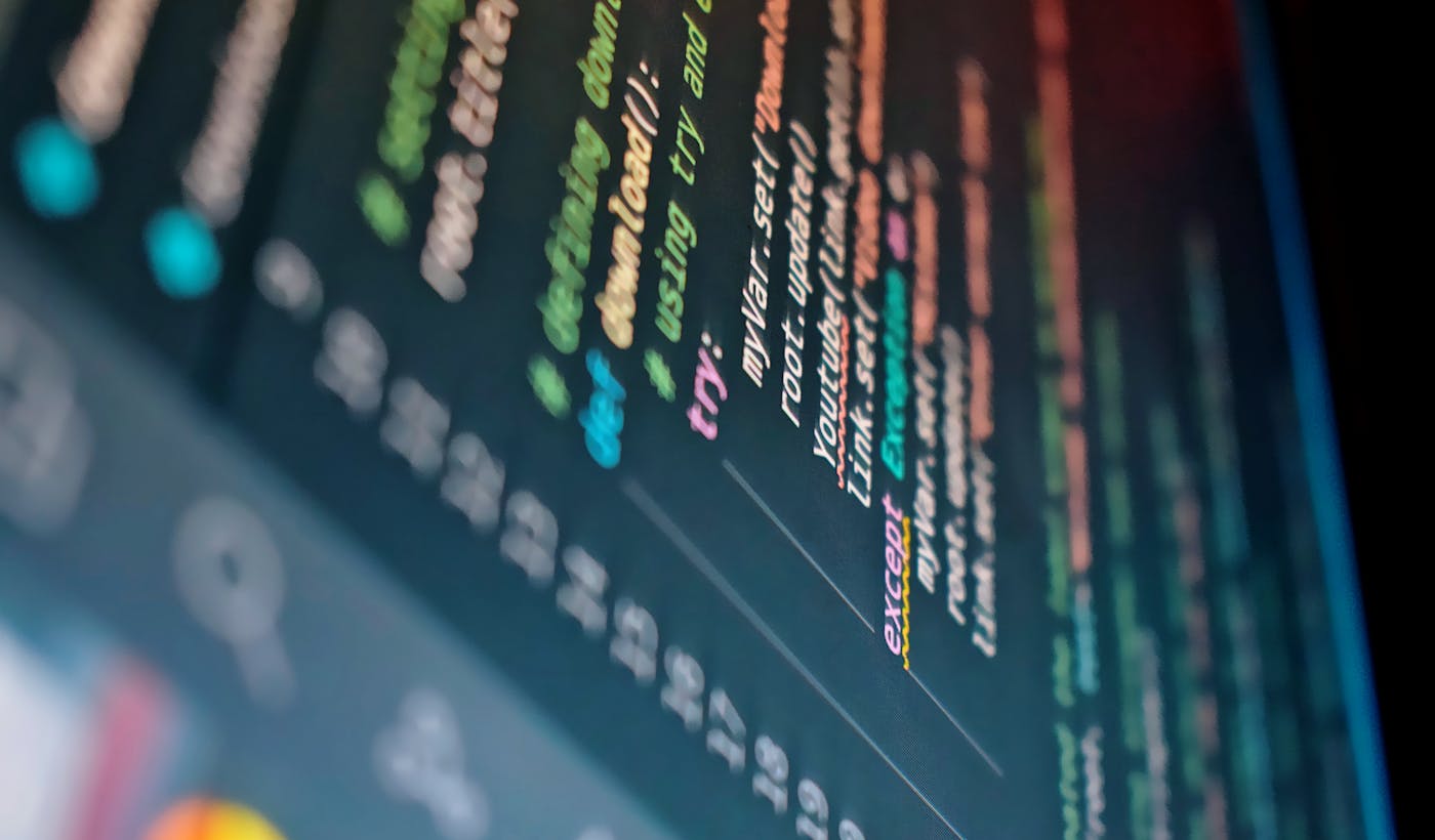 Computer display showing colorful programming code in an editor