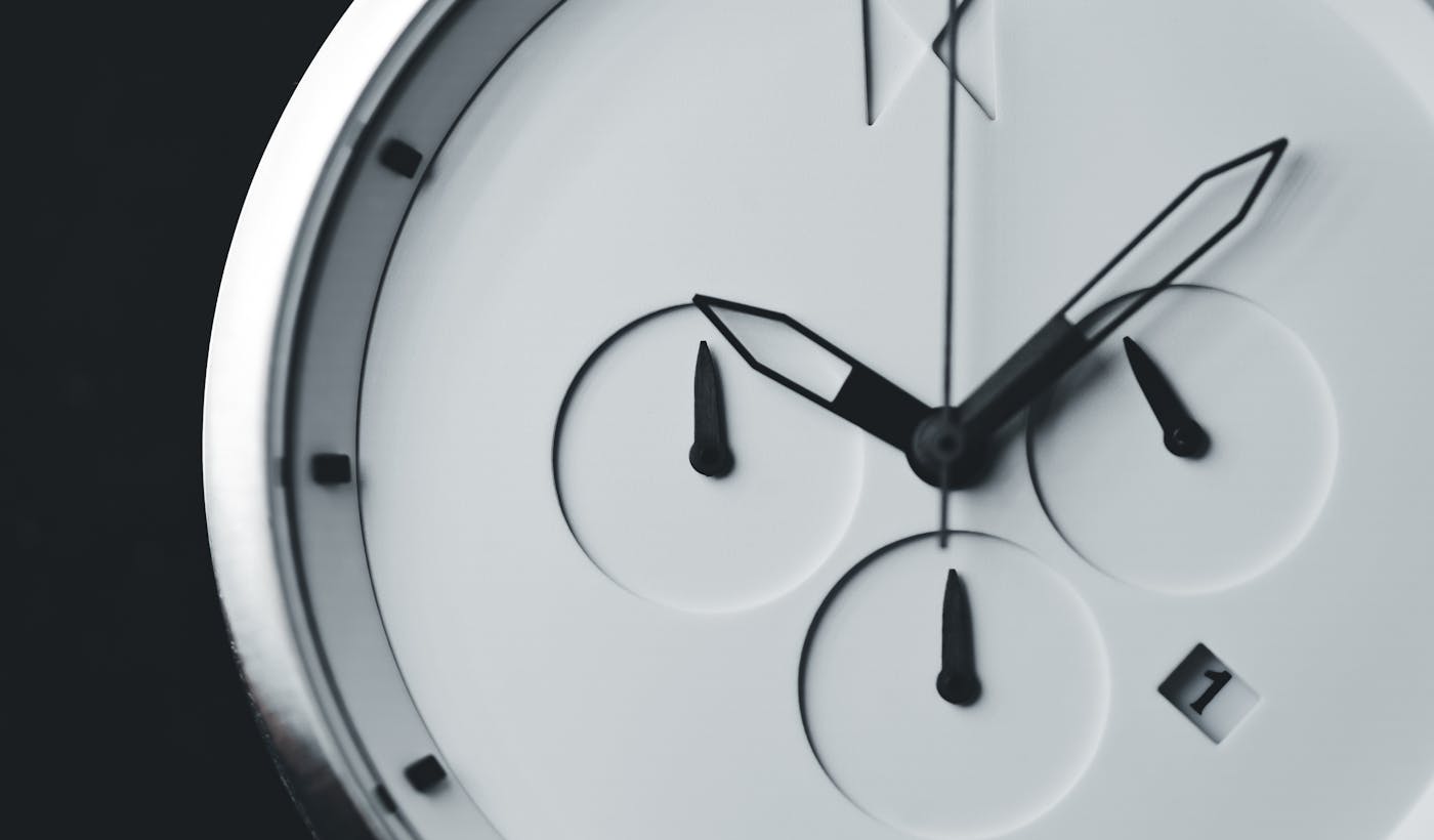 Minimal black and white analog clock face close-up