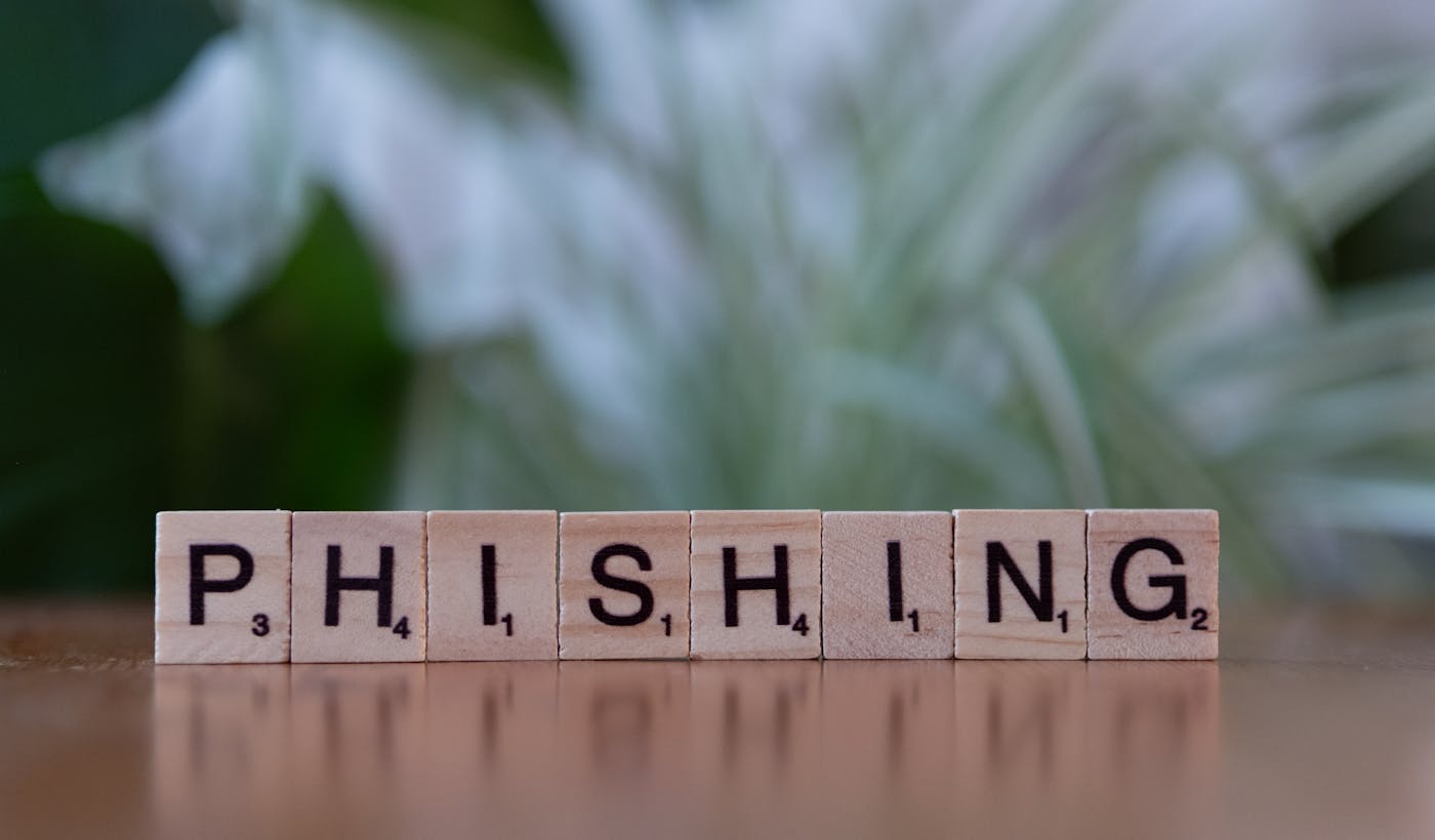 Scrabble tiles spelling phishing to illustrate phishing protection and DMARC