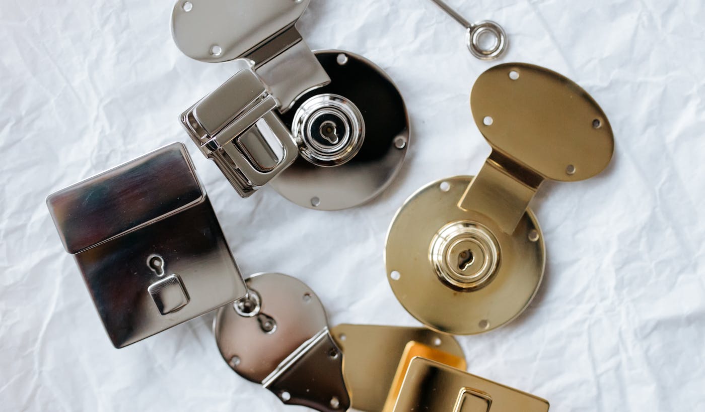 Silver and gold padlocks with a key symbolizing domain unlock and EPP code