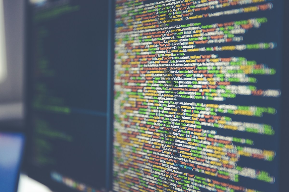 Colorful lines of code on a screen representing a website domain at risk