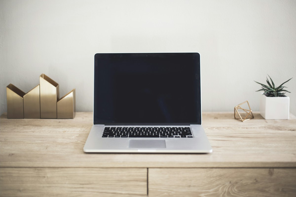 Laptop on a desk showing an email inbox for a custom domain